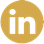A black and gold circle with a letter in it  Description automatically generated with low confidence