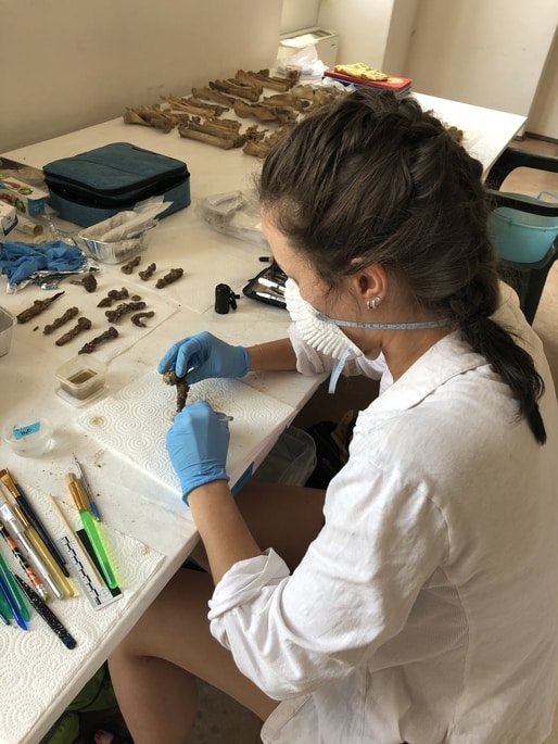 Skyler cleans and coats iron finds at Villa Romana di Poggio Gramignano site in Italy