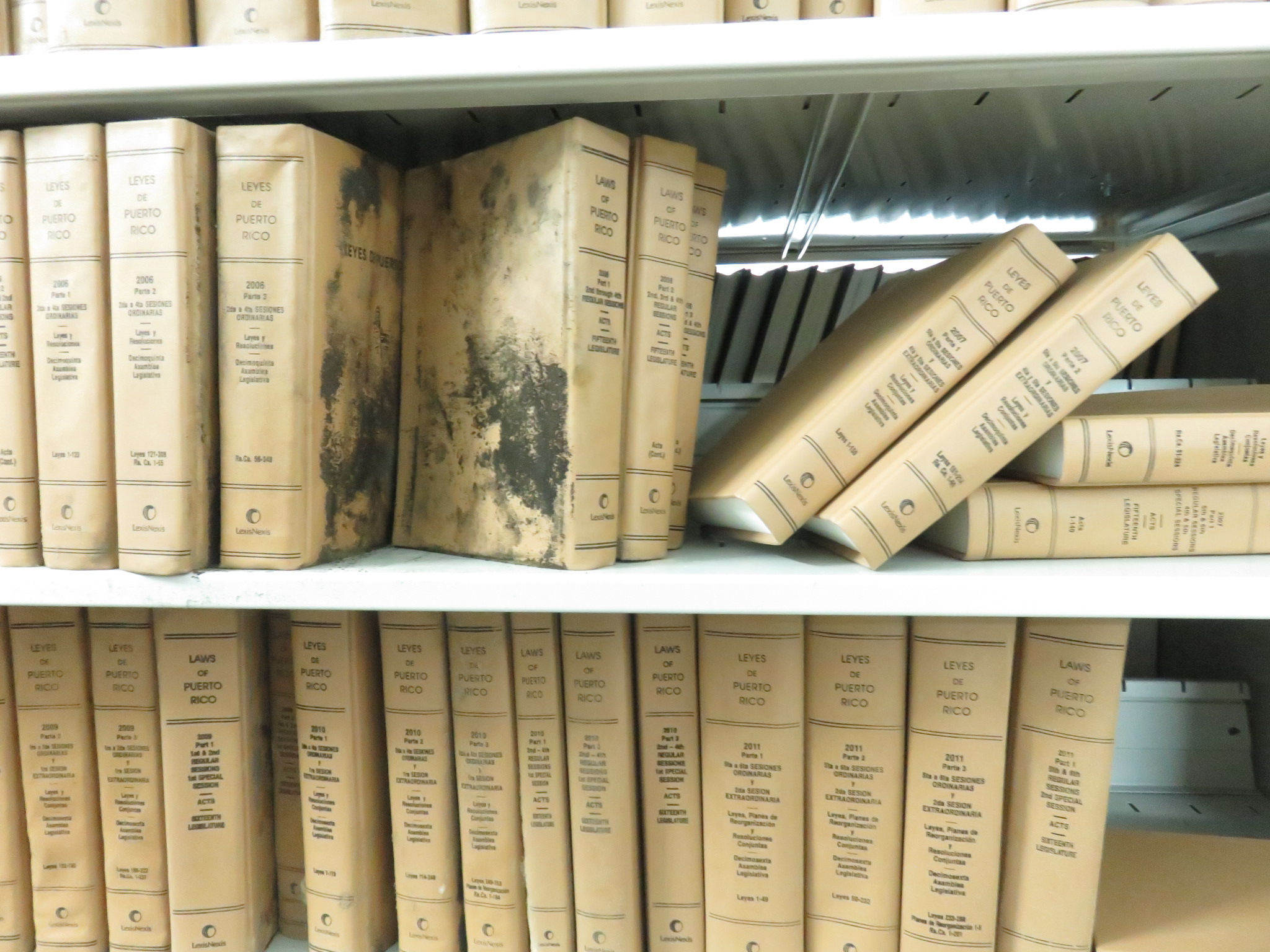 Image of books with mold.