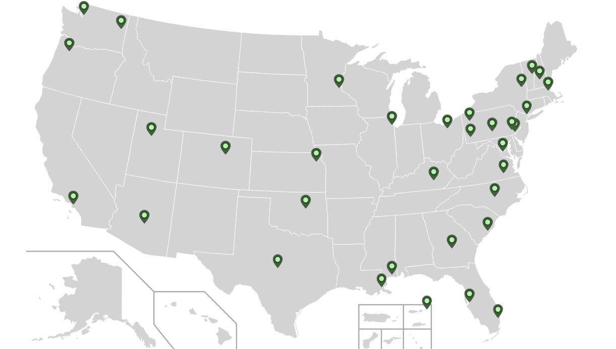 Map of the United States with green pins.