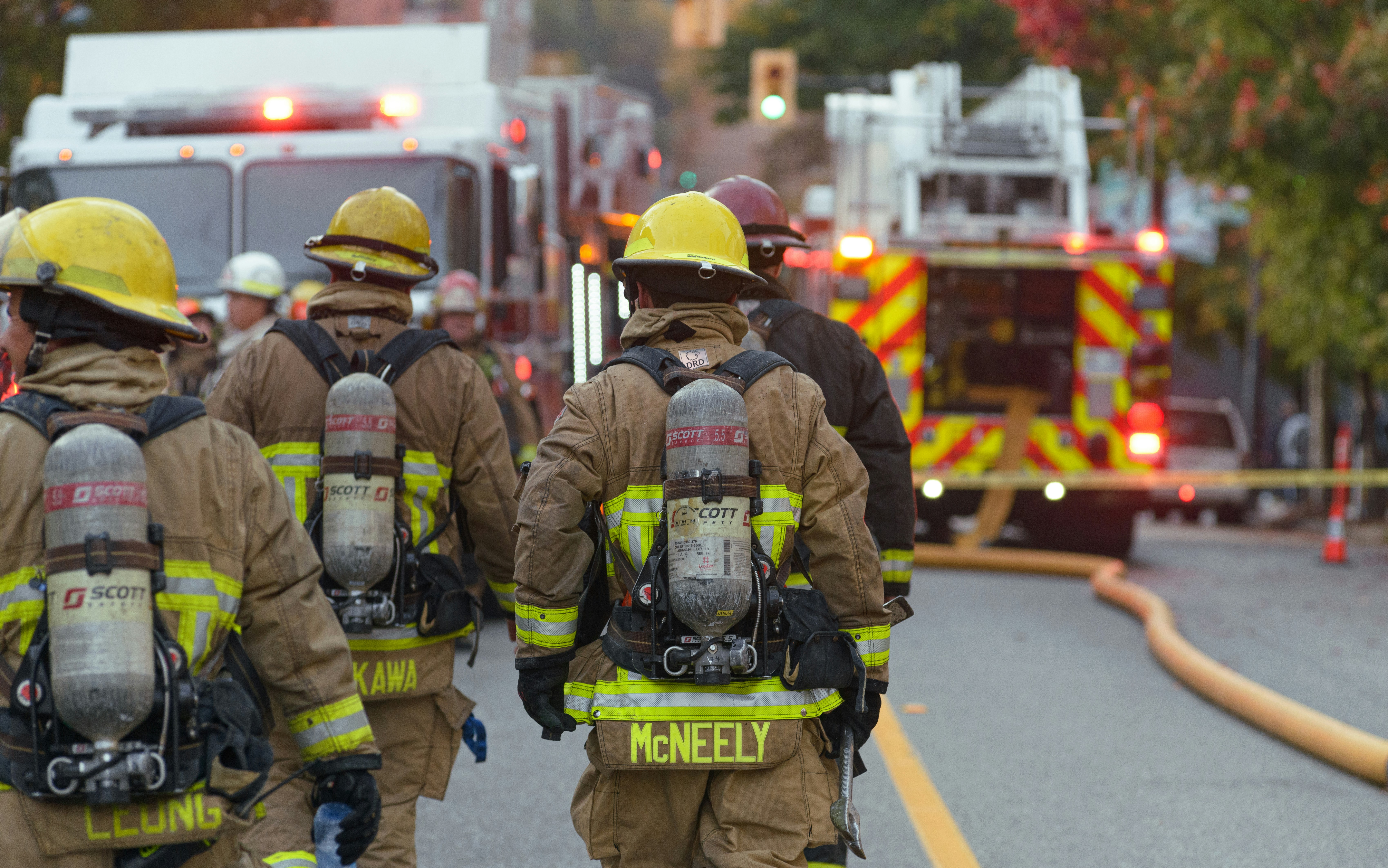 Group of firefighters walking toward truck
