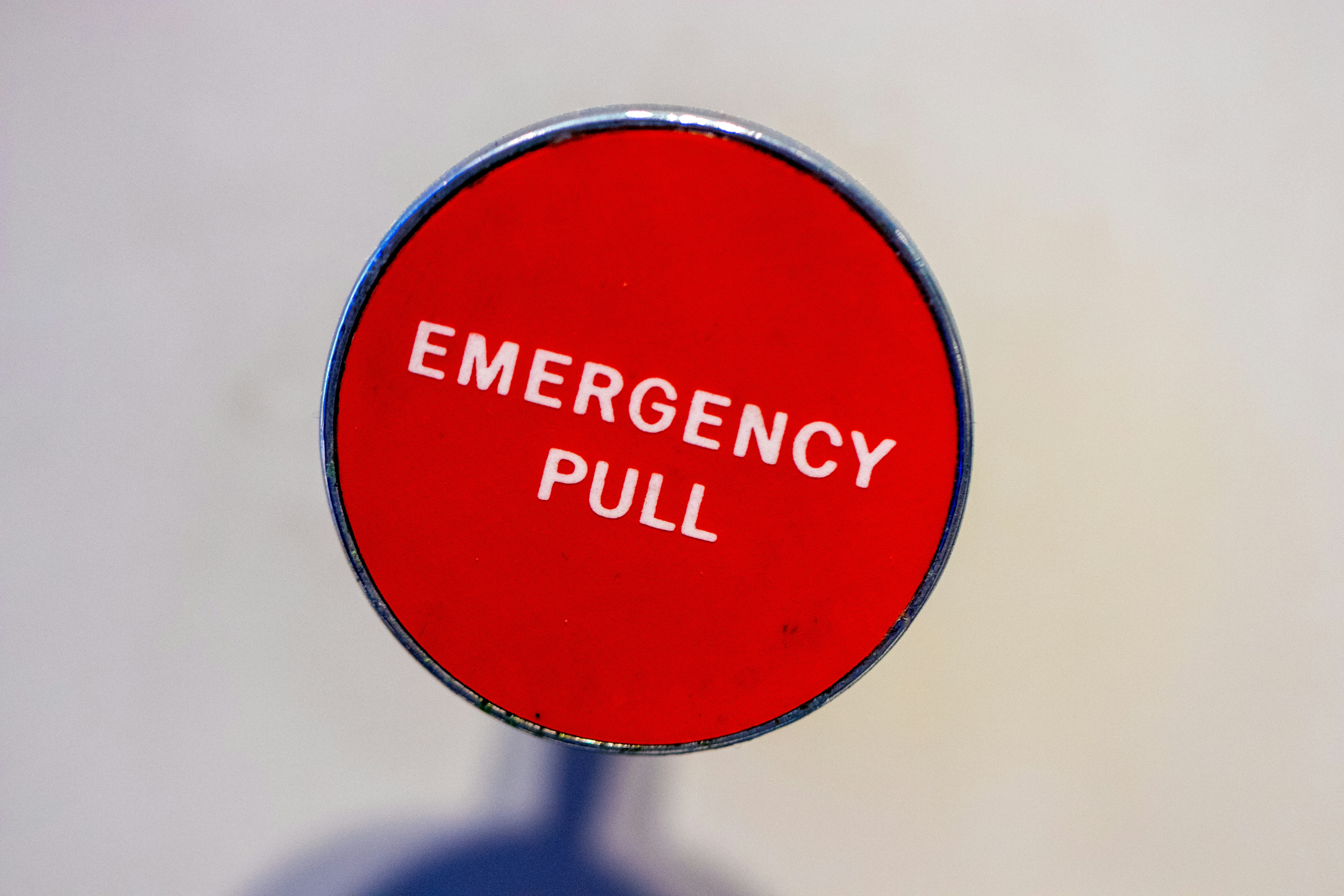 Image of a red circle with the words "emergency pull"