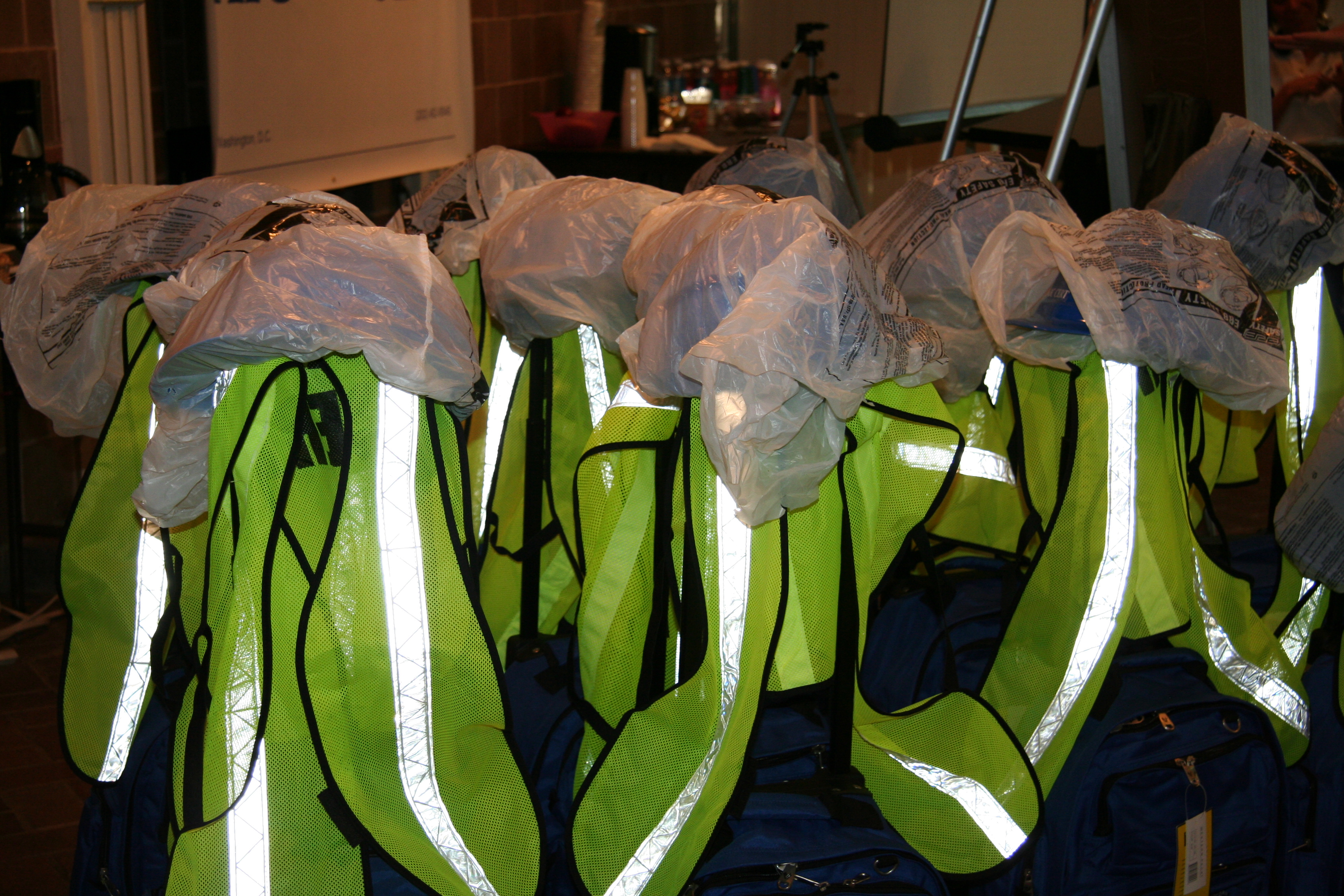 Many bright yellow vests