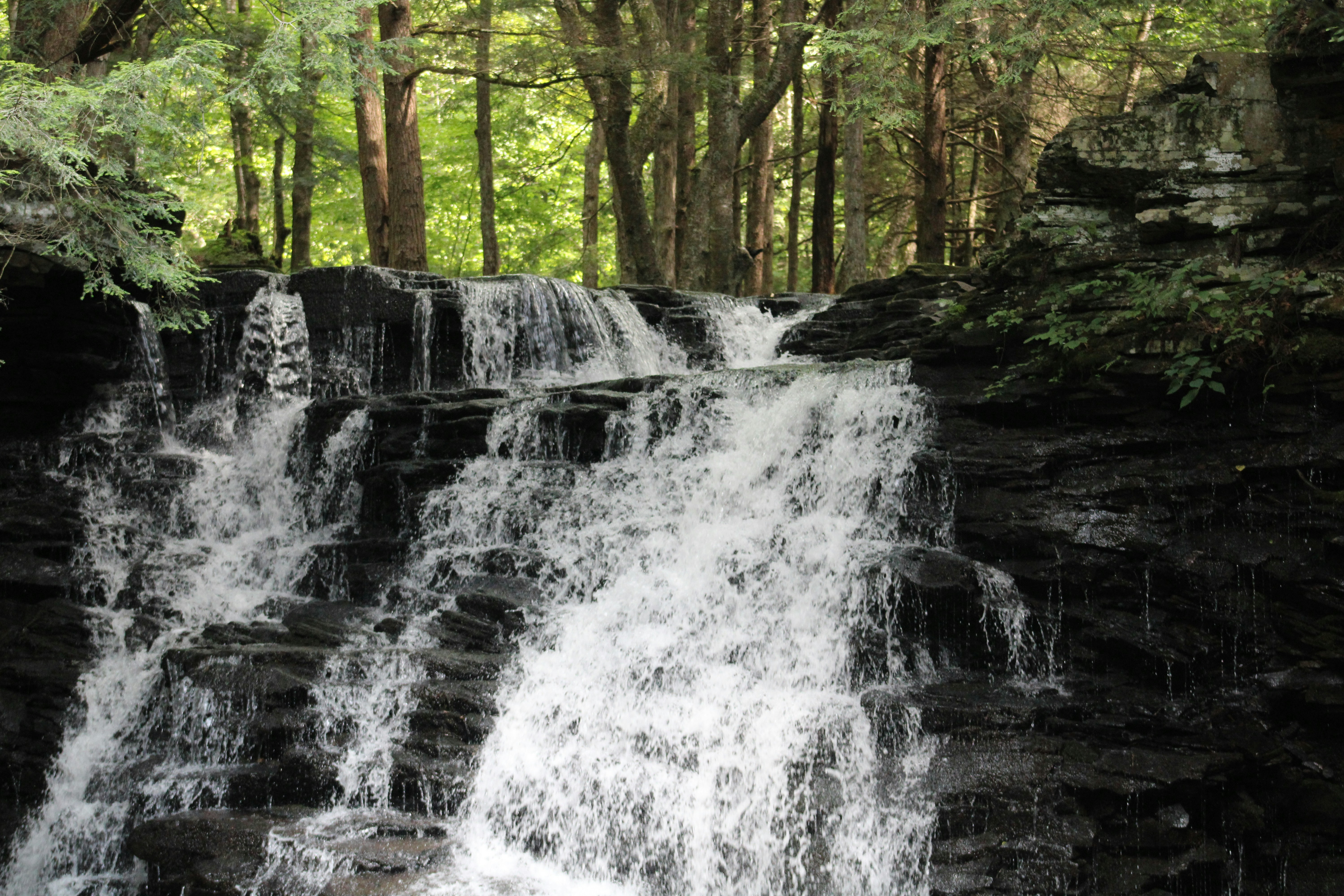 Waterfall over black rock