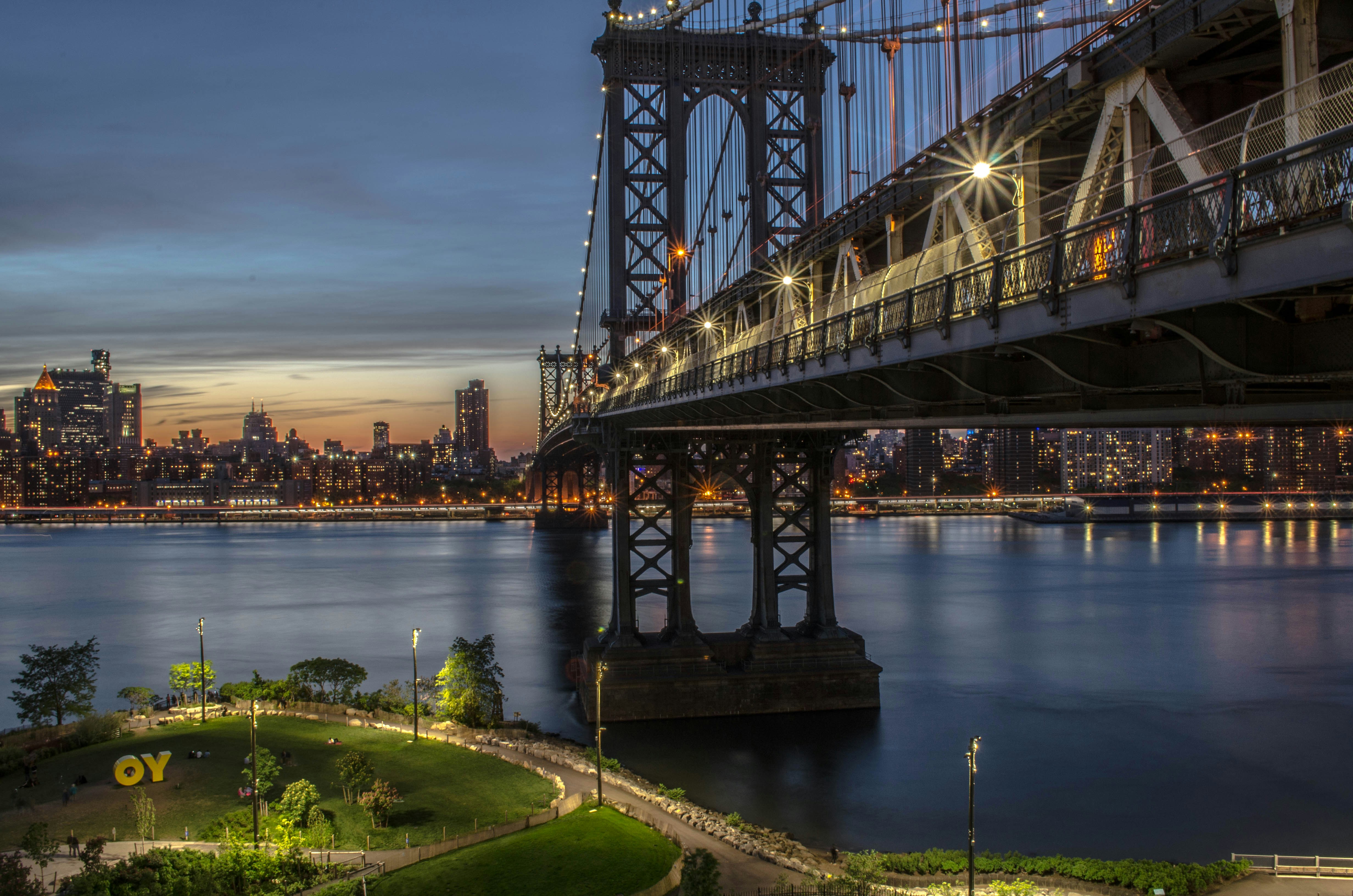 Image of a bridge with a city in the background