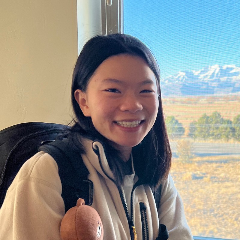 Headshot of a woman with medium-length brown hair 