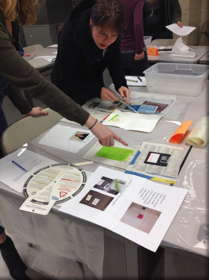 Image of red bucket with plastic clamped overhead.