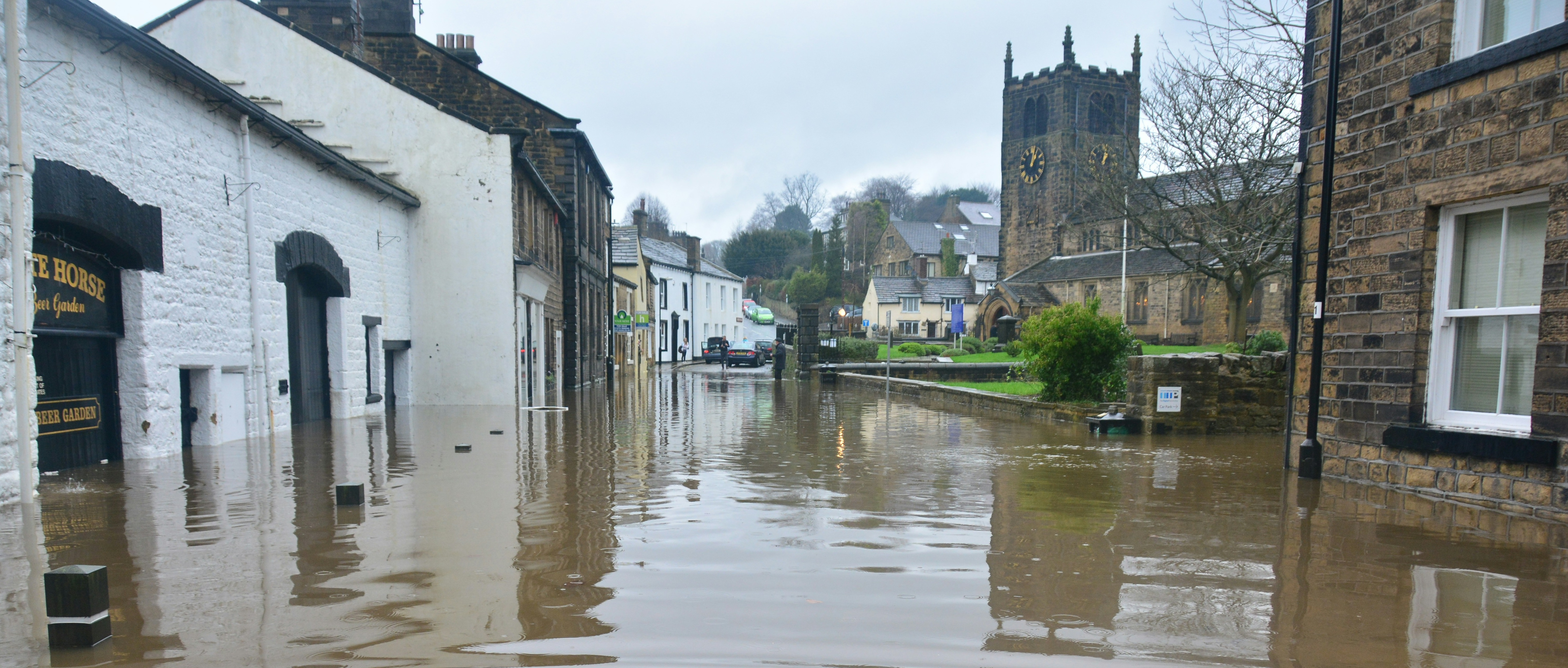 Photo shows a flooded town.
