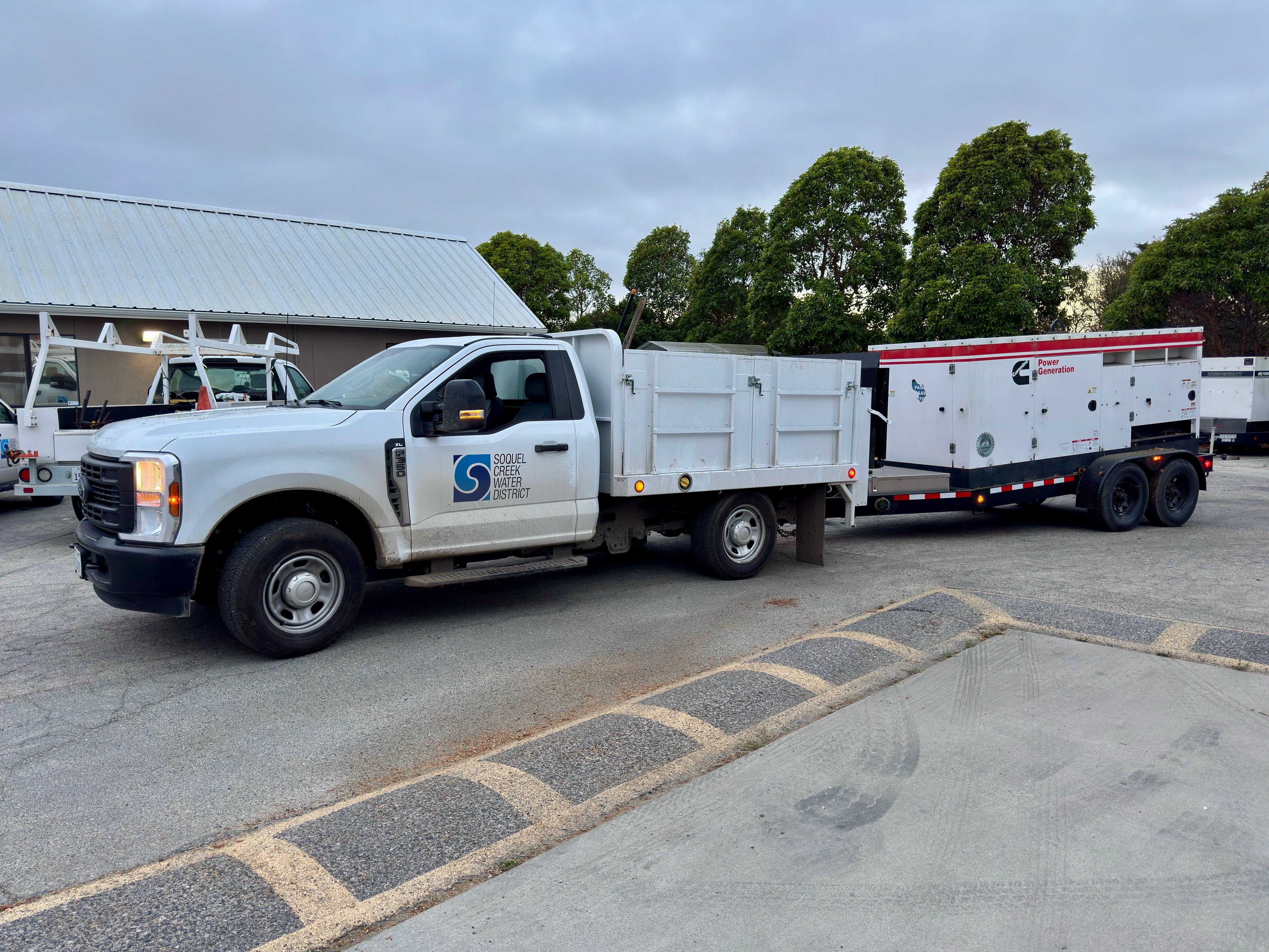 Image of a Soquel Creek Water District truck towing a generator.
