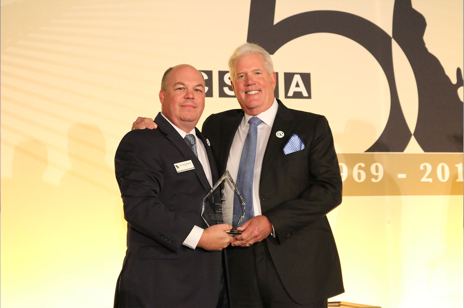 David receiving the award from Neil