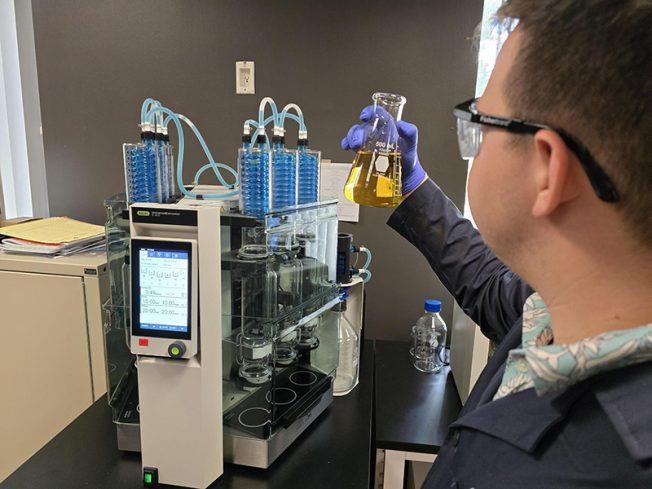 Technician tests water sample