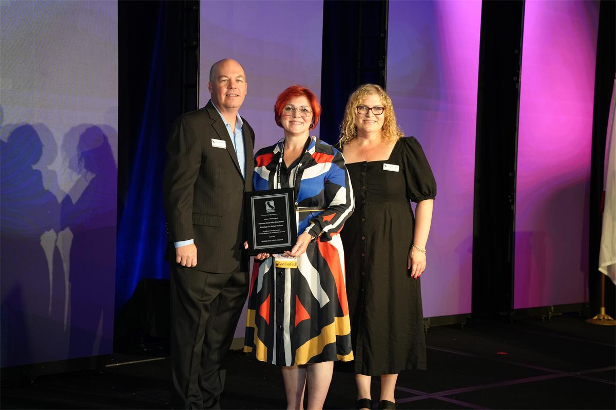 District representative Lona Williams accepted the award