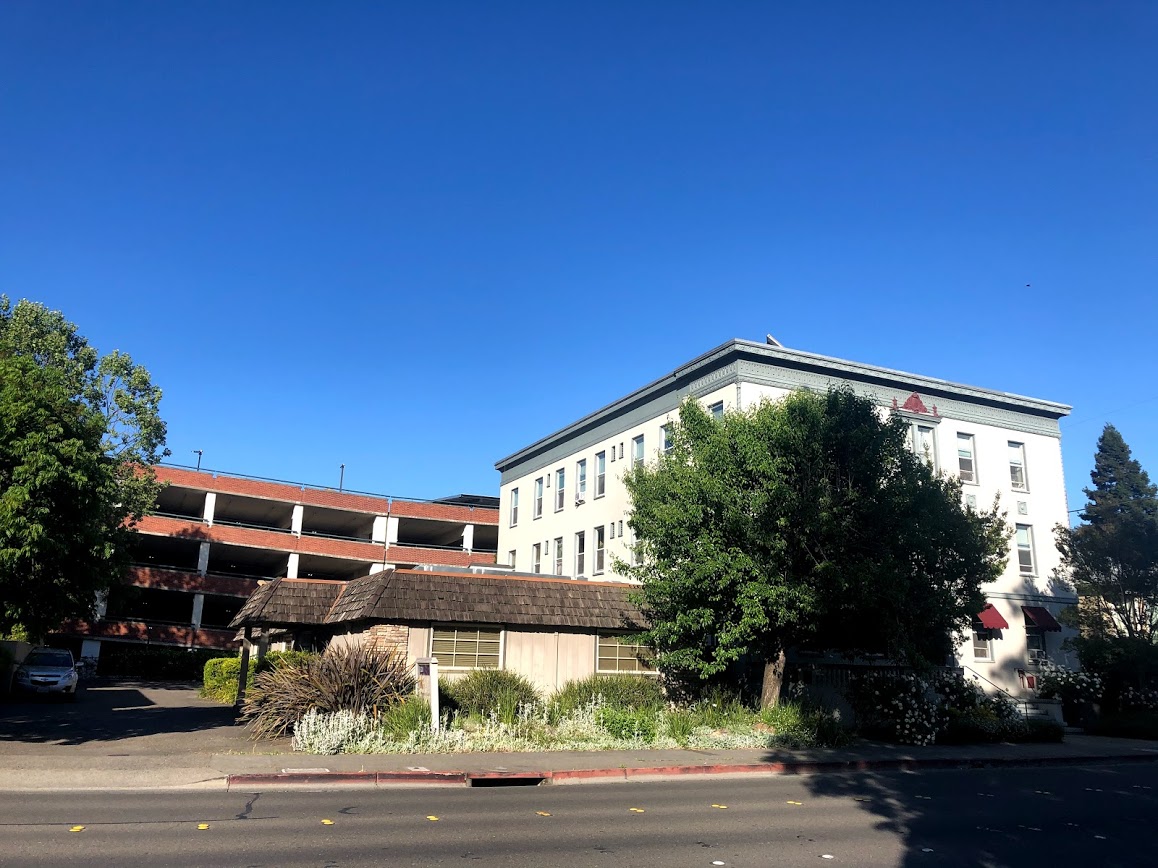 One one-story building and a multi-story building next to each other