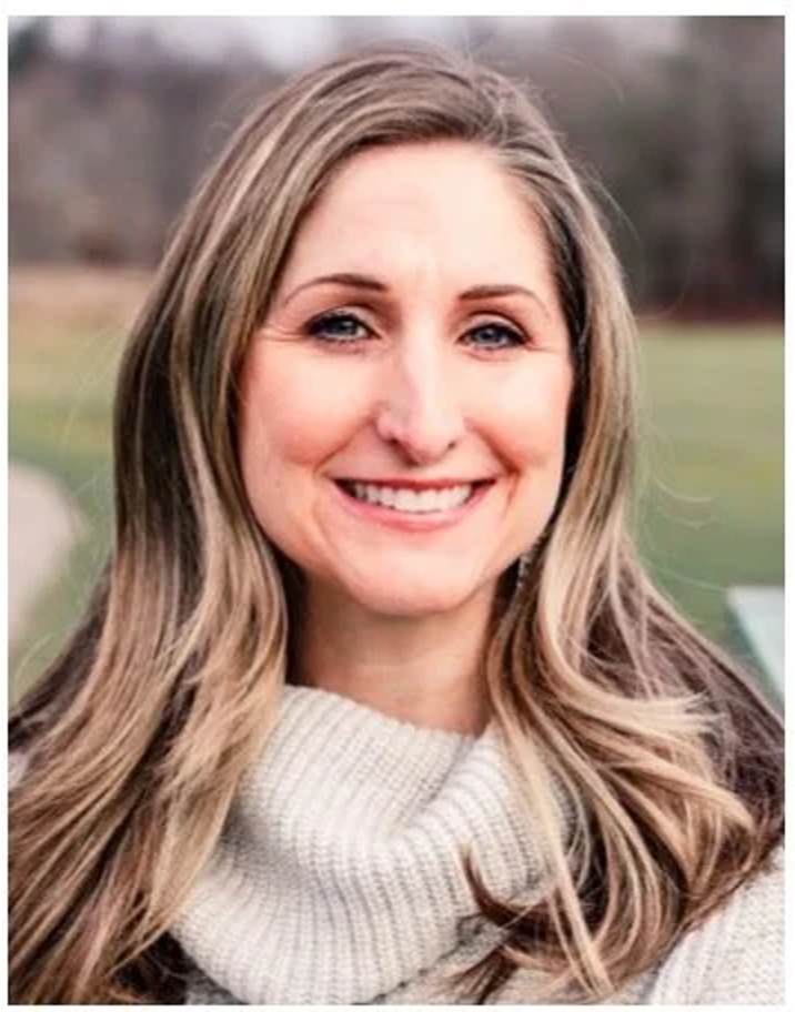 A photo of a smiling woman