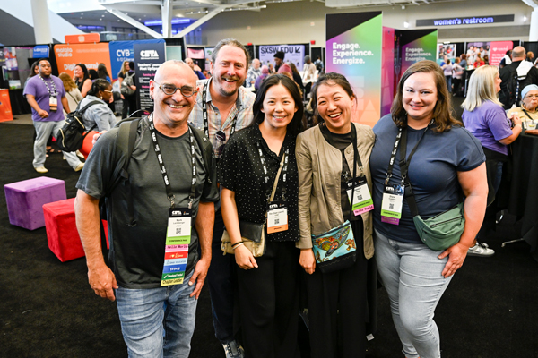 Educators smiling in a group at the 2025 CSTA Cleveland Conference
