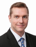 A person in a suit and tie

AI-generated content may be incorrect.