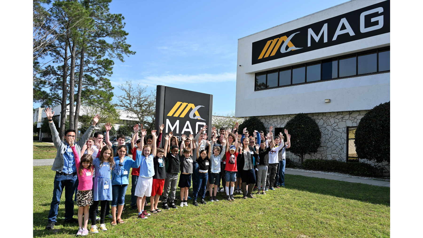 Class photo outside of MAG Office