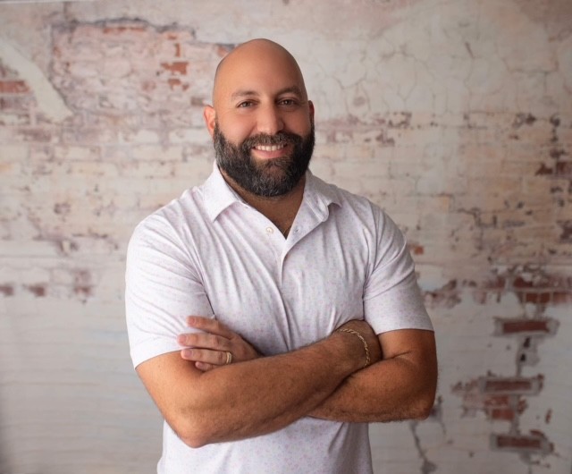 man light skin dark beard and no hair on head