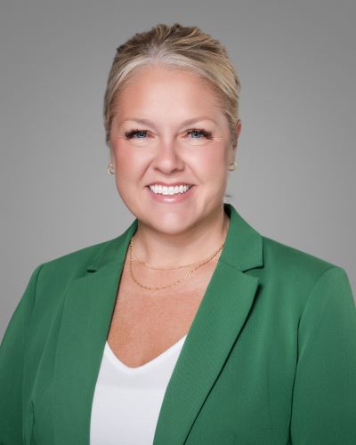 woman blond hair green jacket - light skin