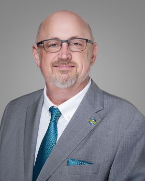 man - no hair - suit - light skin