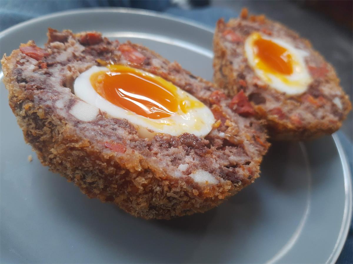 A handmade Scotch Egg with chorizo
