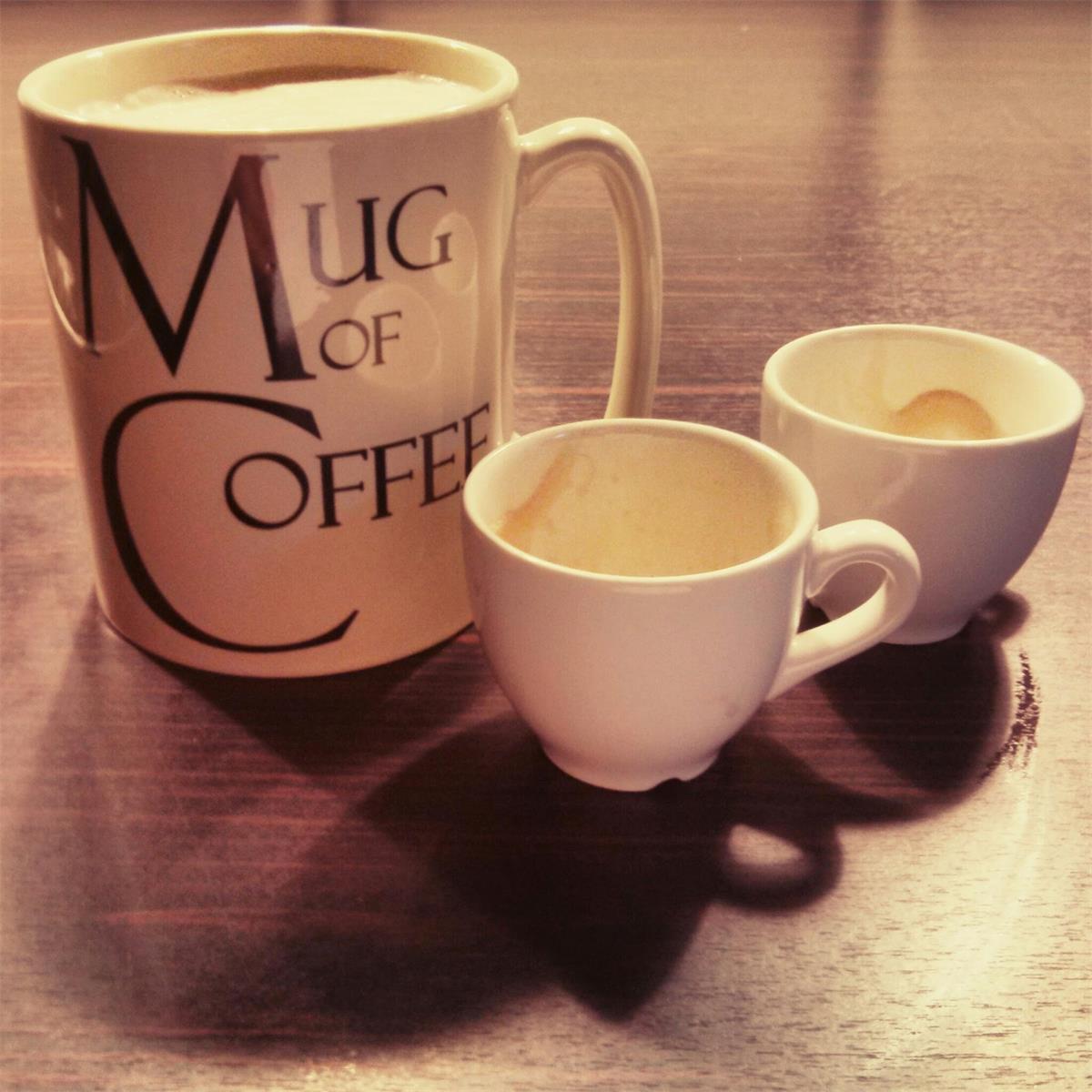 A large coffee mug, and two espresso cups