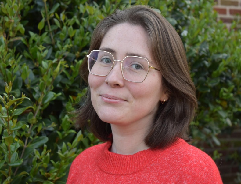 Headshot of smiling woman in glasses