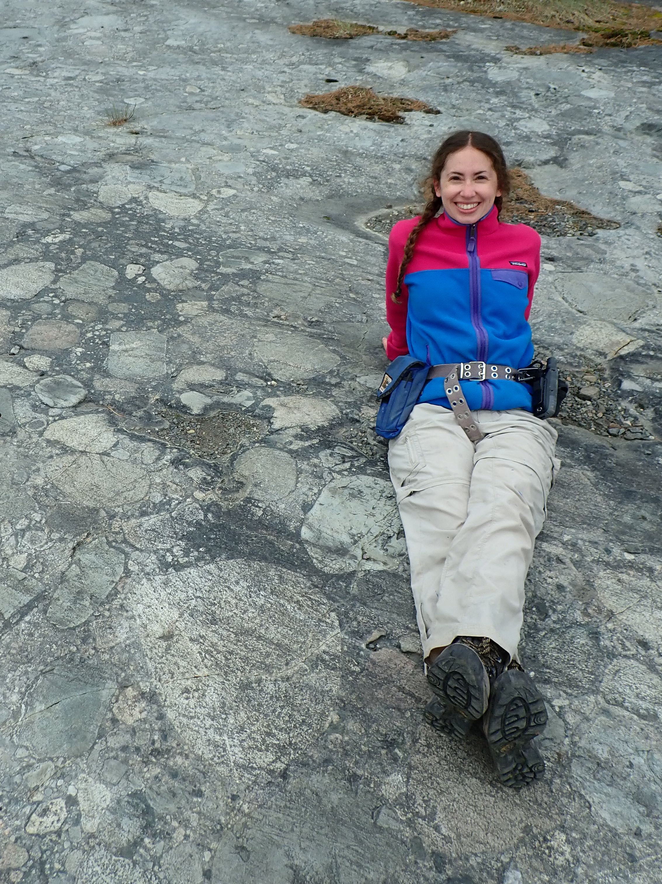 Sarah Slotznick laying on a bed of stromatolite heads