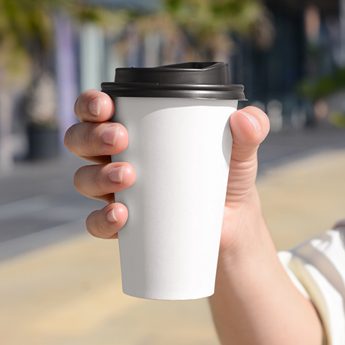 hand holding a to go coffee