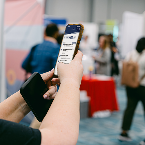 hand holding a phone with app displayed
