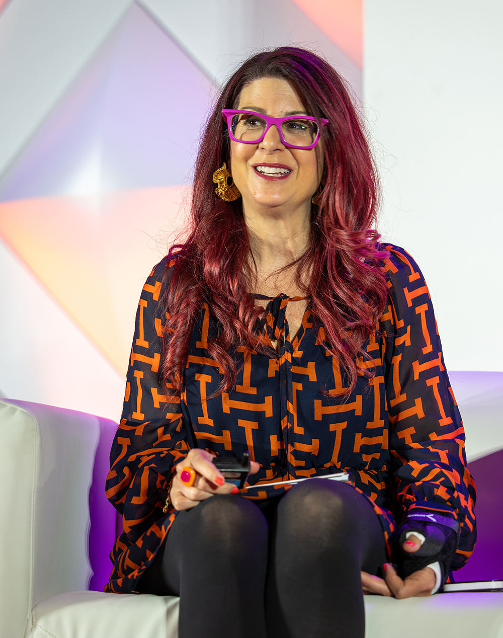 speaker on stage at a past Super Forum event