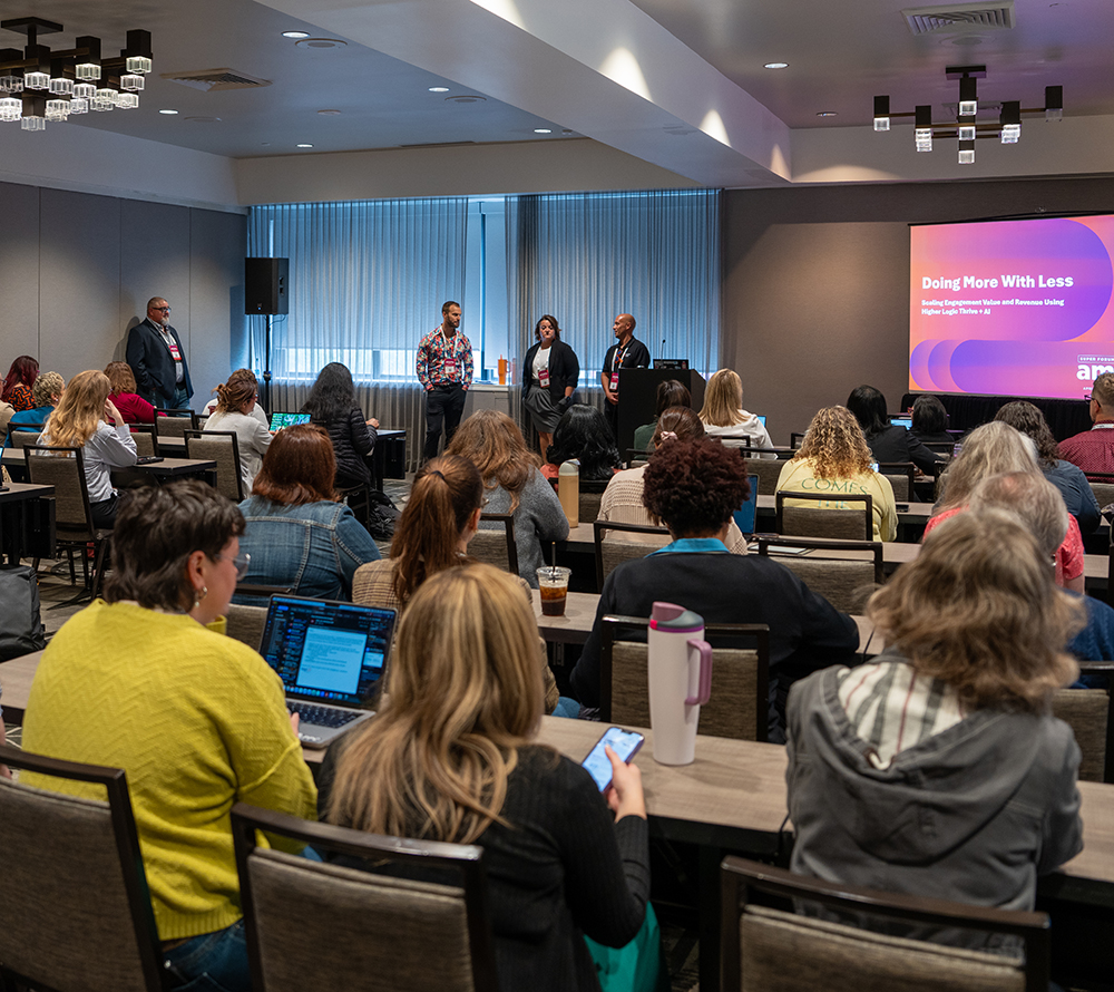 a session room full of attendees at a past Super Forum event