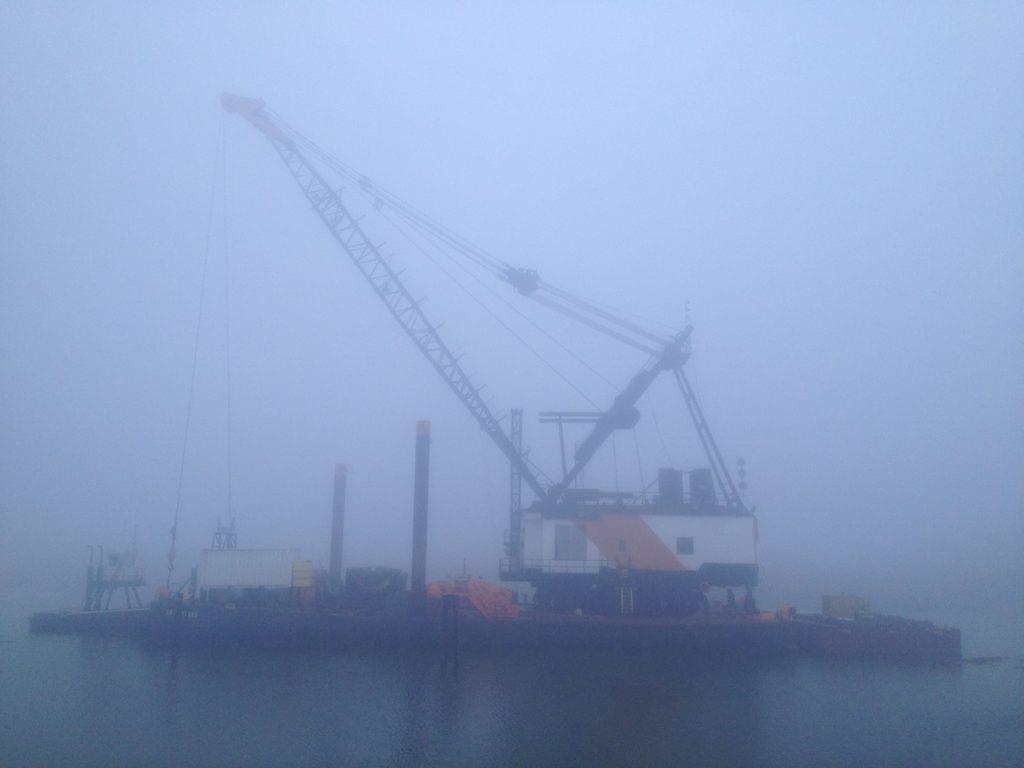 Dredge on the Duwamish River in Seattle on a foggy day