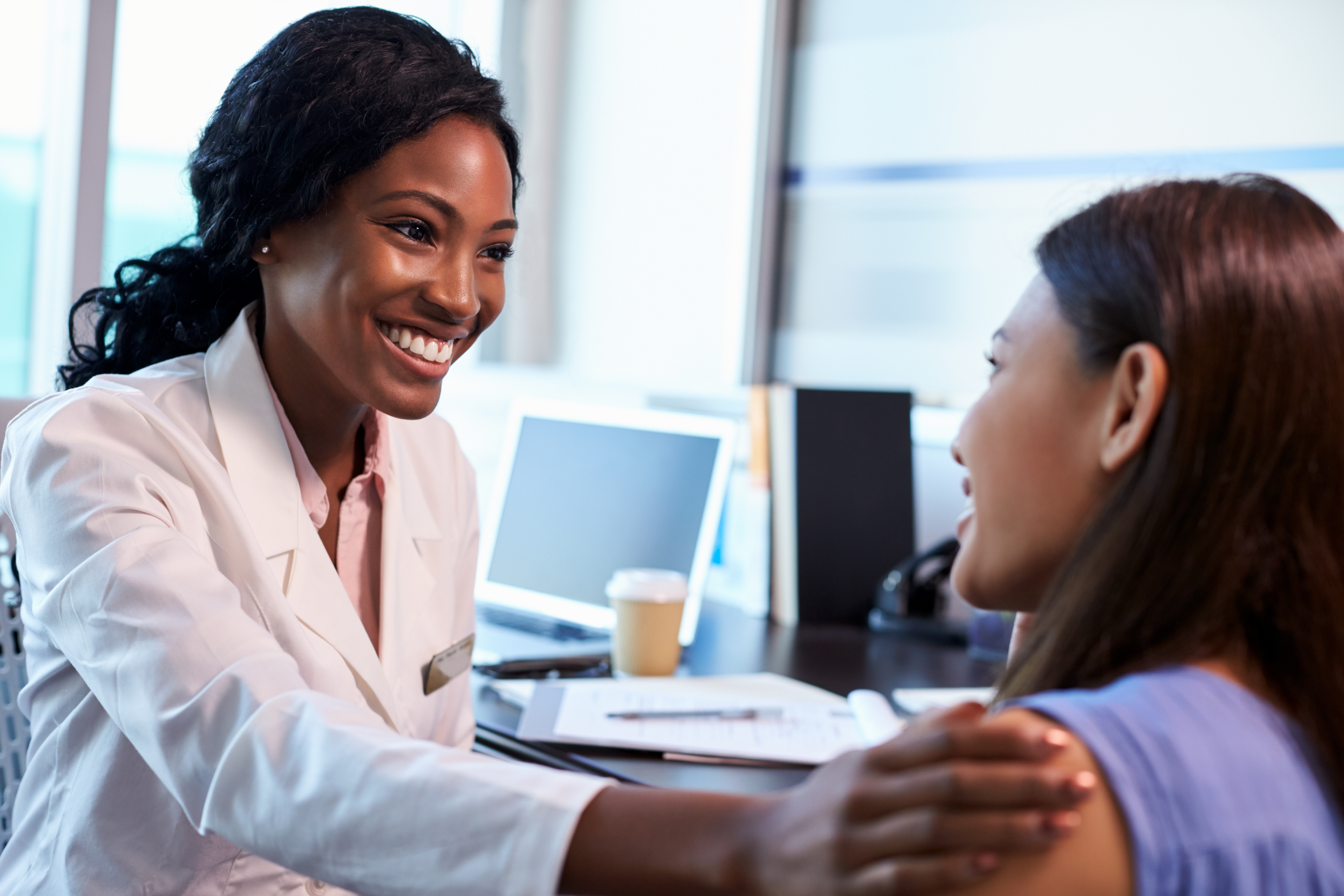 A professional consulting with a patient