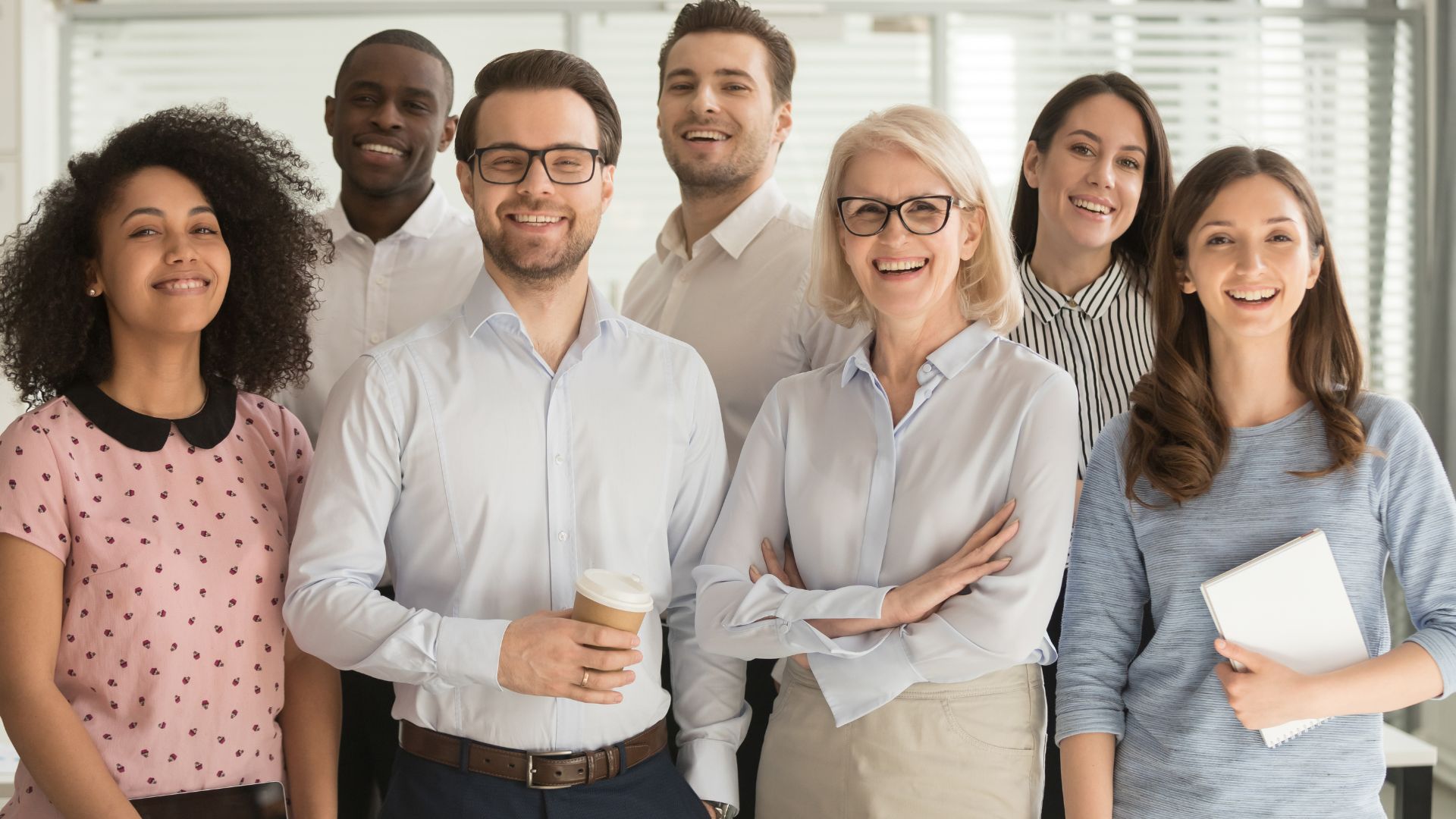 Team standing looking positive