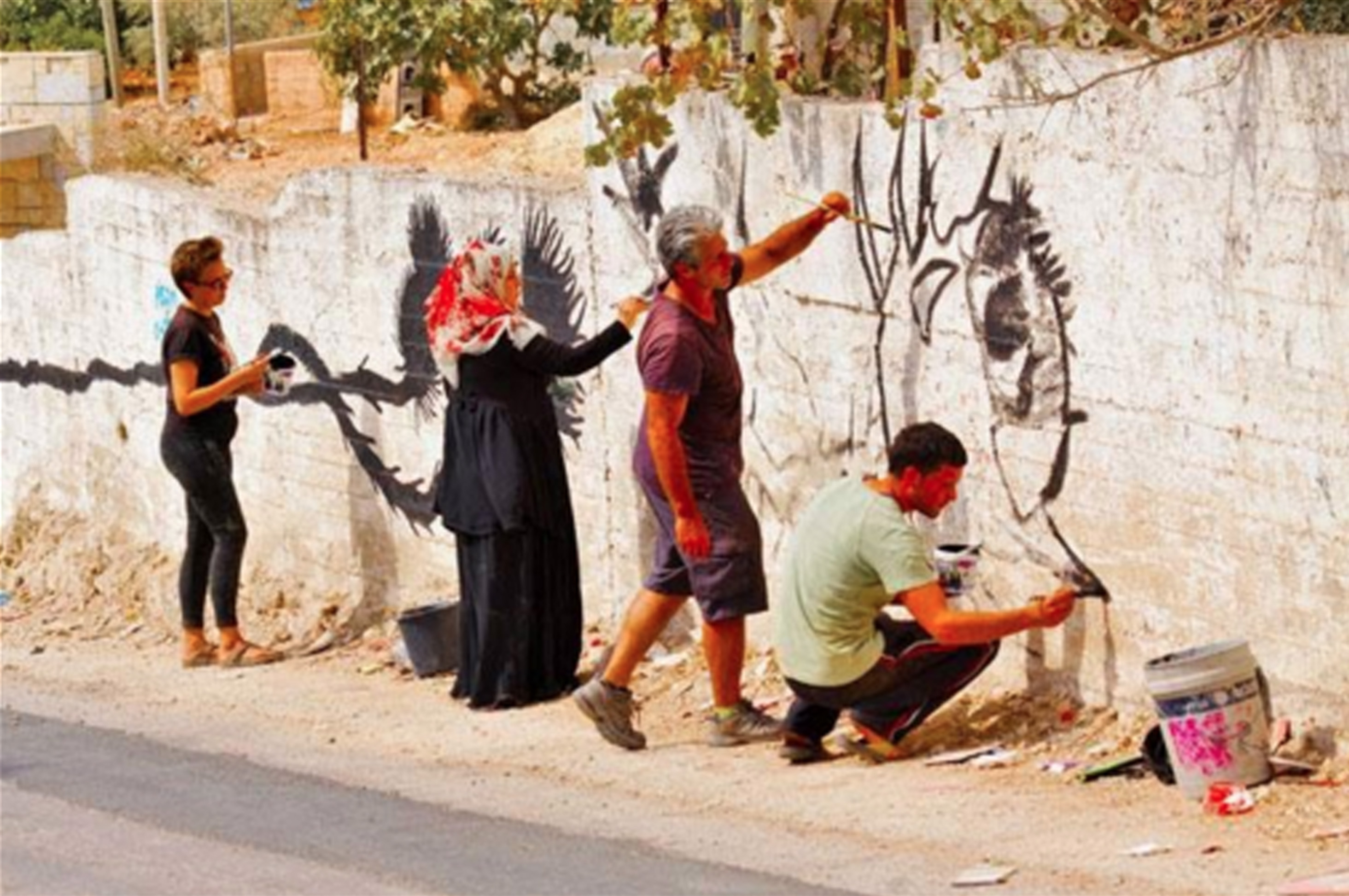 Letelier, second from right, works with the Bil’in community.
