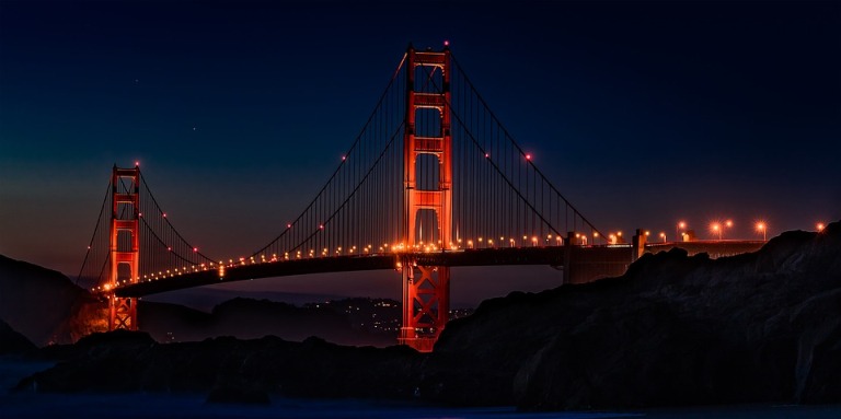 Golden Gate Bridge lit up against a night sky