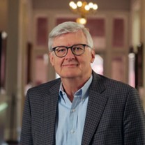 A person in a suitAI-generated content may be incorrect.