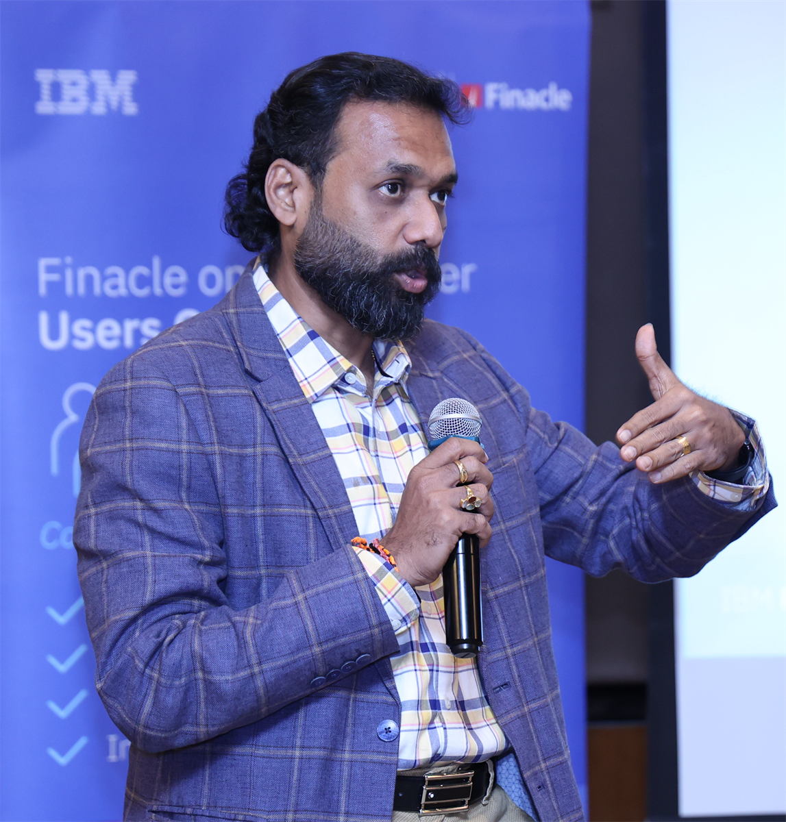 Unnikrishnan Rajagopal speaking at Finacle on Power User Group Meeting