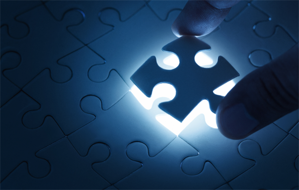 spot glowing under puzzle piece being placed in an otherwise complete but blank puzzle