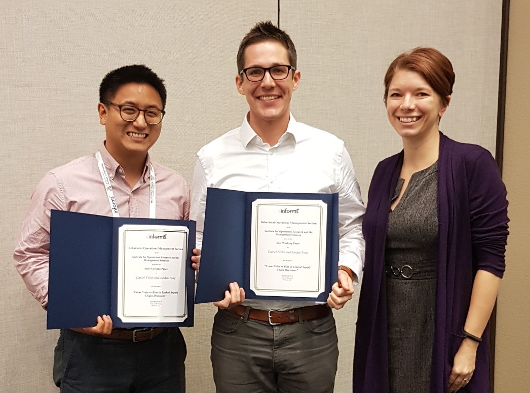 J. Tong, D. Fuller, J. Niederhoff pose with award