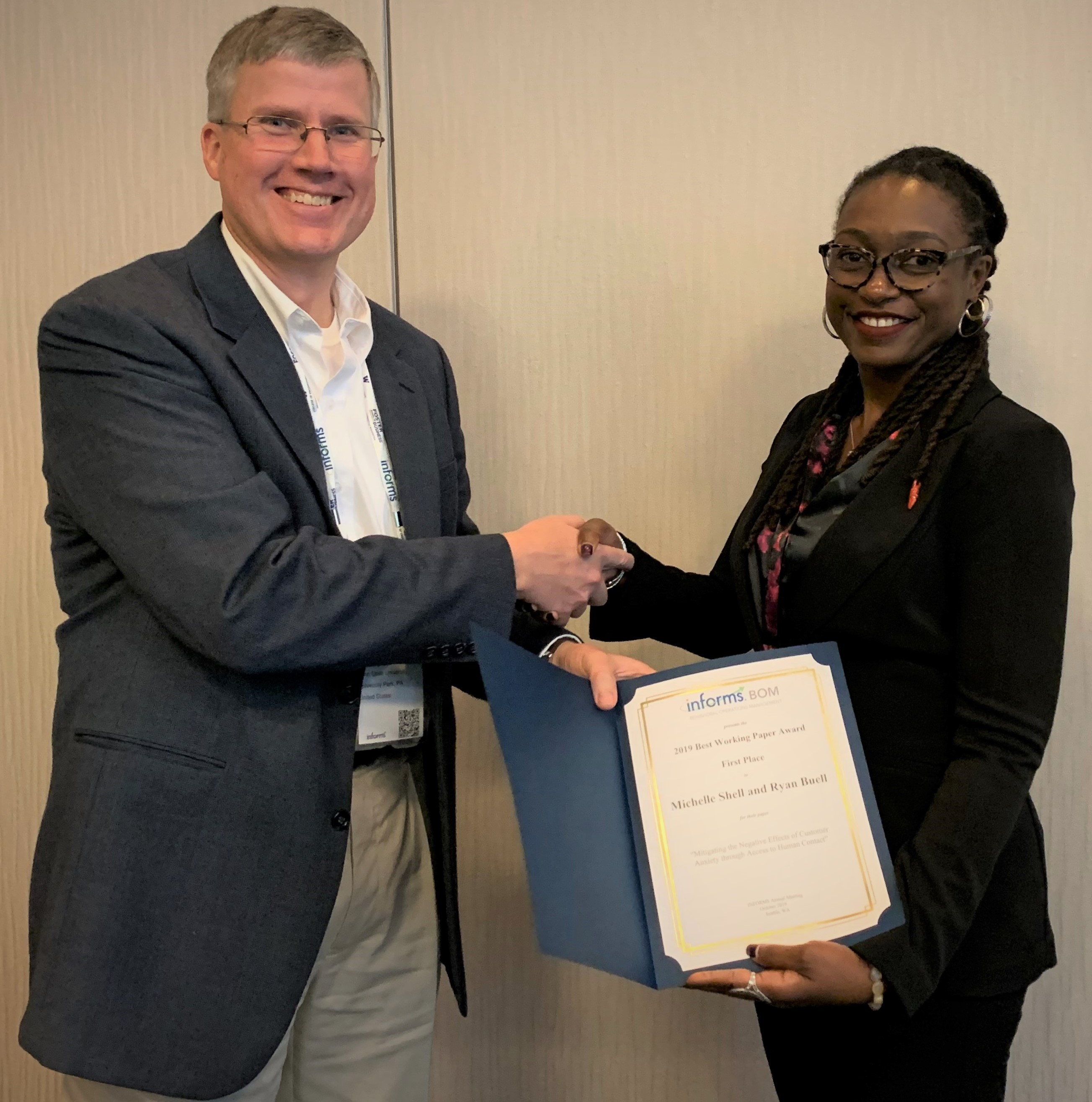 2019 Winner Brent Moritz presents award to winning presenter Michelle Shell.