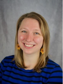 A person smiling with earrings
AI-generated content may be incorrect.