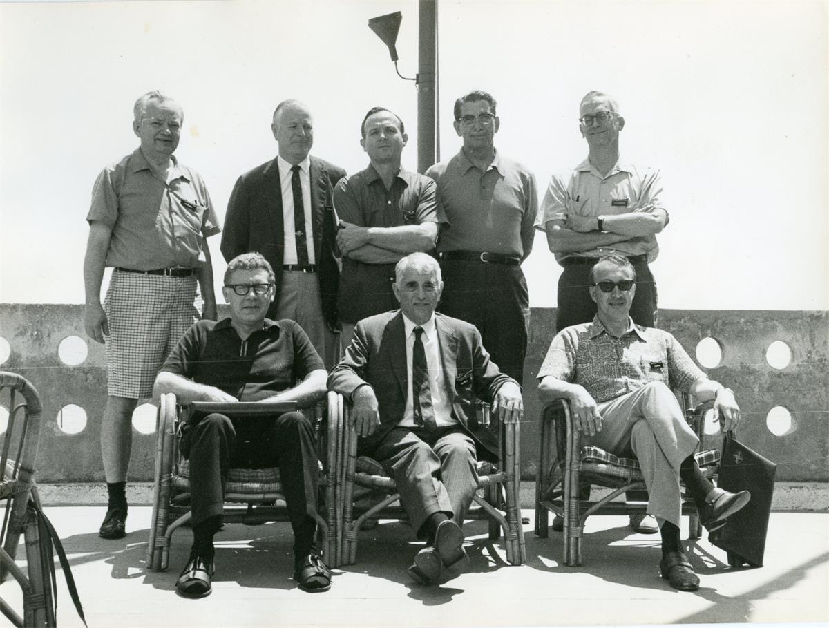 Eight men attending the IFORS Triennial Conference in 1969, in Venice, Italy