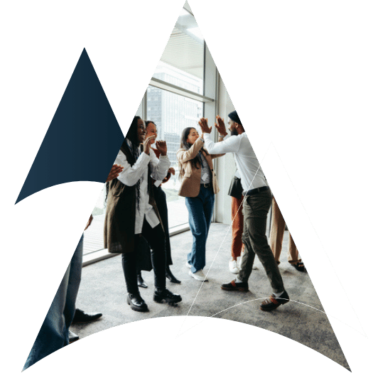 Corporate team celebrating success with high fives during a team building event in a modern office space
