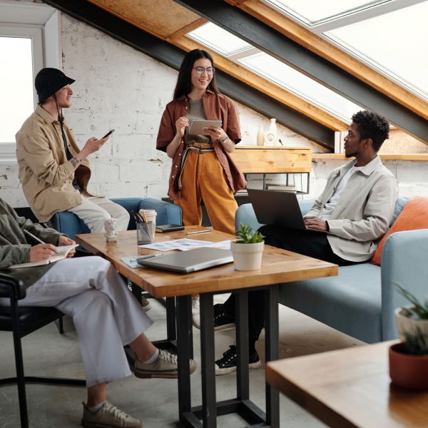 A group of young professionals talking to each other