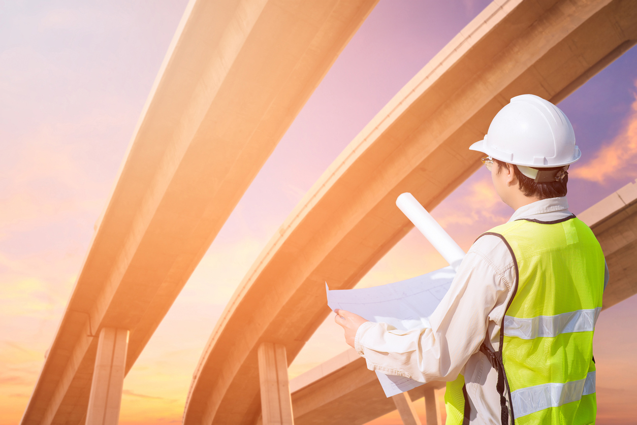 Construction-engineer-checking-construction-drawing-with-expressway-transportation-construction-673808832_1256x838__1_.jpeg