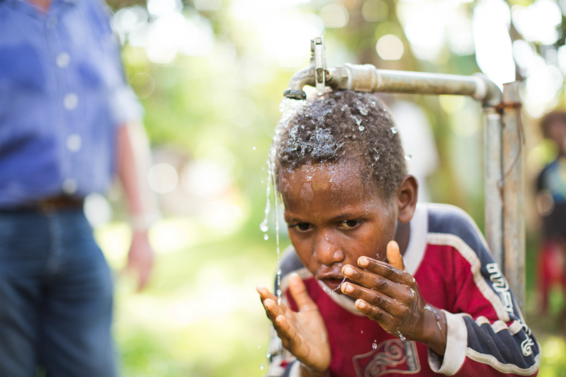 child_showering_vanuatu_resized.jpg