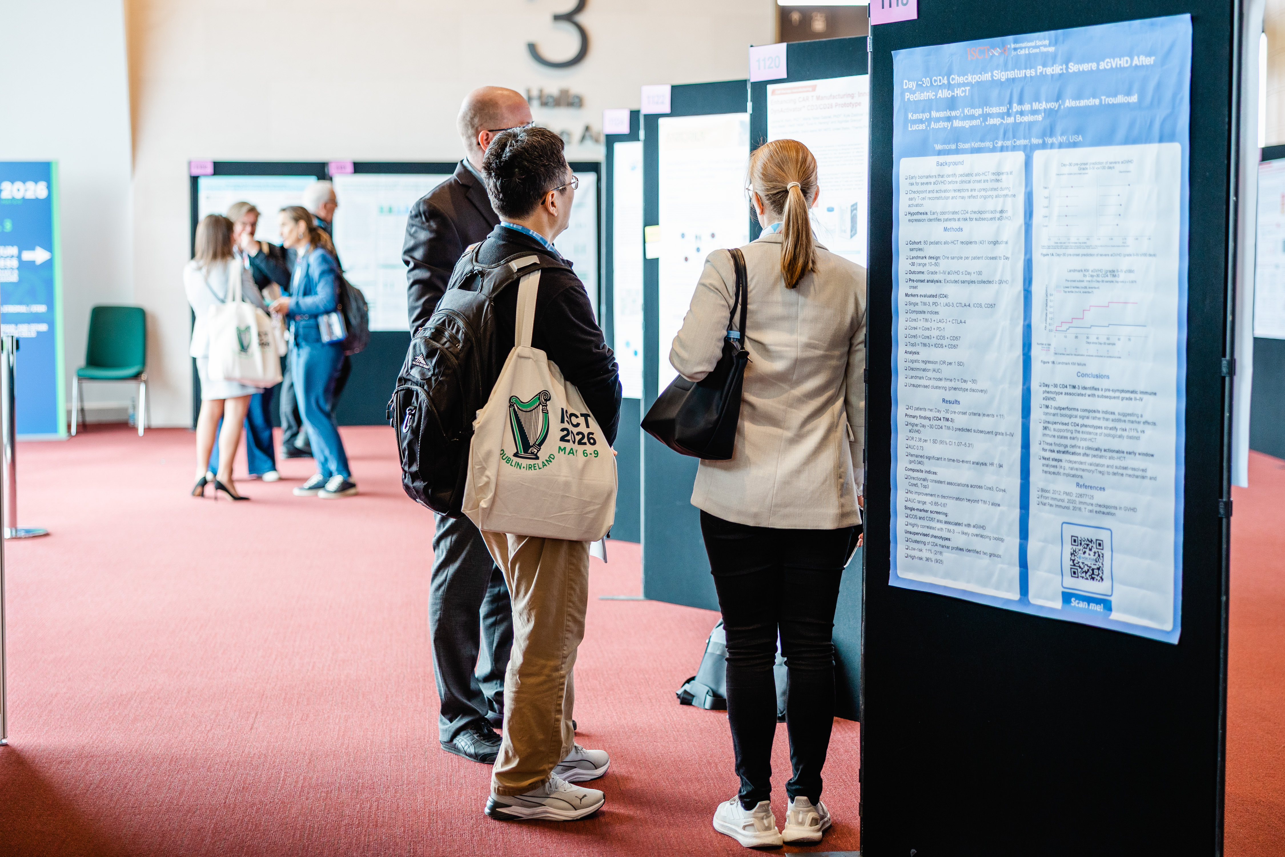Delegates networking at posters