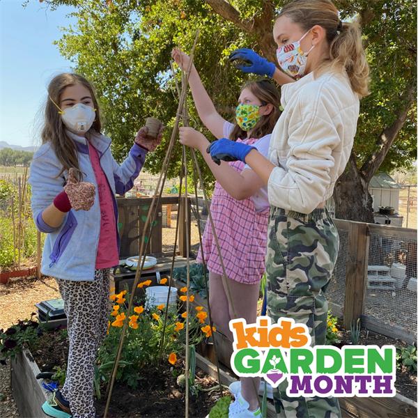 Photo of three girls setting up a pole trellis in a garden bed with Kids Garden Month logo in the corner